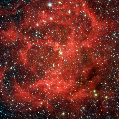Vergleichsansichten des Spitzer-Weltraumteleskops im sichtbaren Licht und Infrarot des leuchtenden Trifidnebels, einer riesigen sternbildenden Gas- und Staubwolke, 5.400 Lichtjahre entfernt im Schützen. Wissenschaft Astronomie von National Aeronautics and Space Administration National Aeronautics and Space Administration